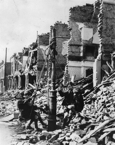 Children playing in a bomb-damaged street 1943 (Source: BBC)